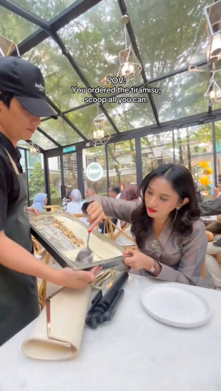 msian woman scoops tiramisu in all you can scoop viral promo kl cafe pic3