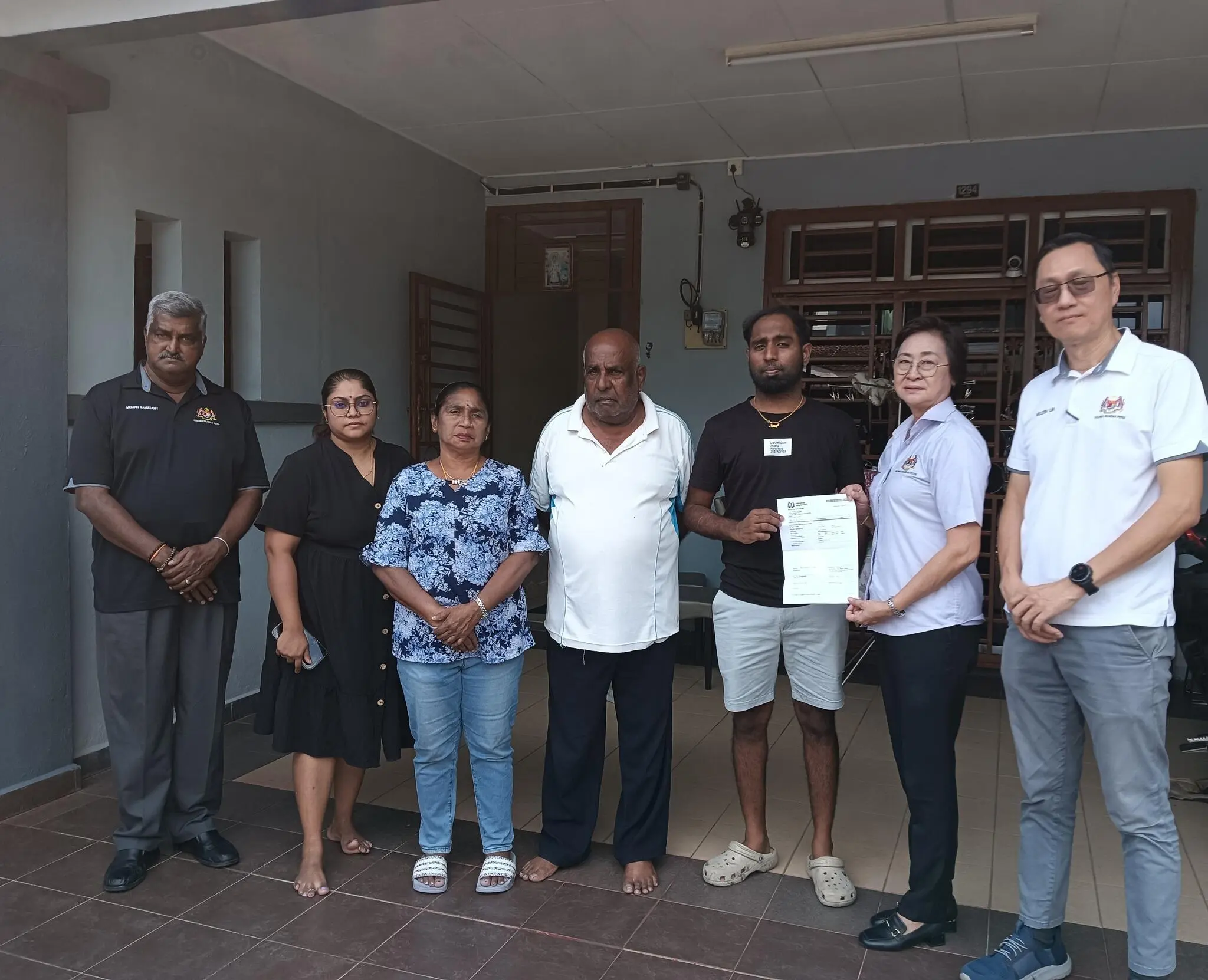 Nidiyanathan showing police report he made