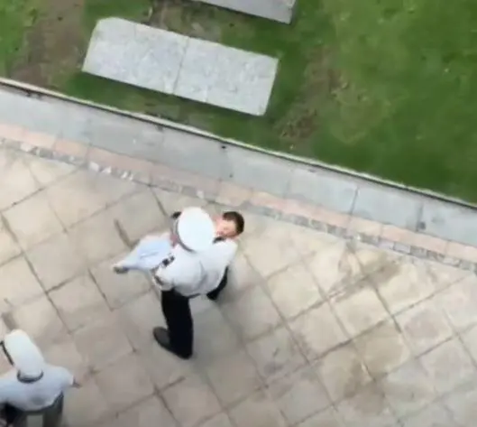 Officer carries boy who fell from 20th floor to hospital