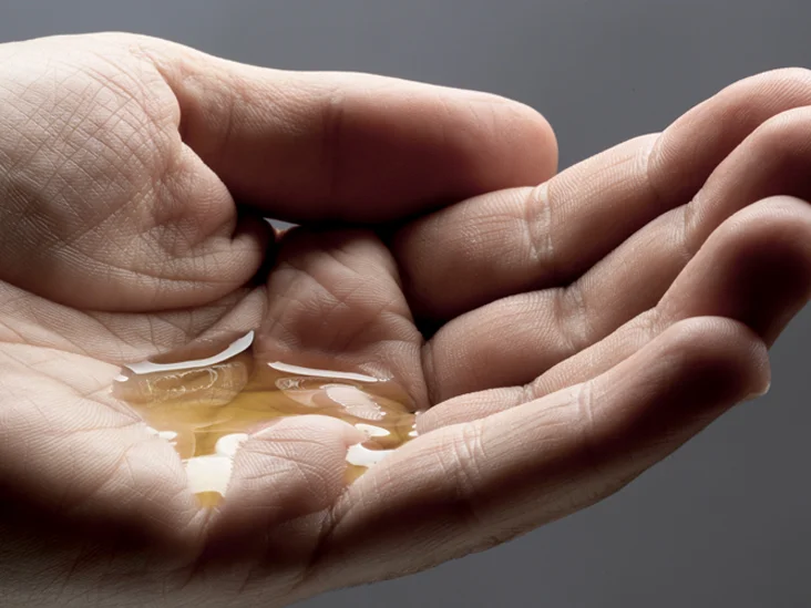 oil on the palm of hand