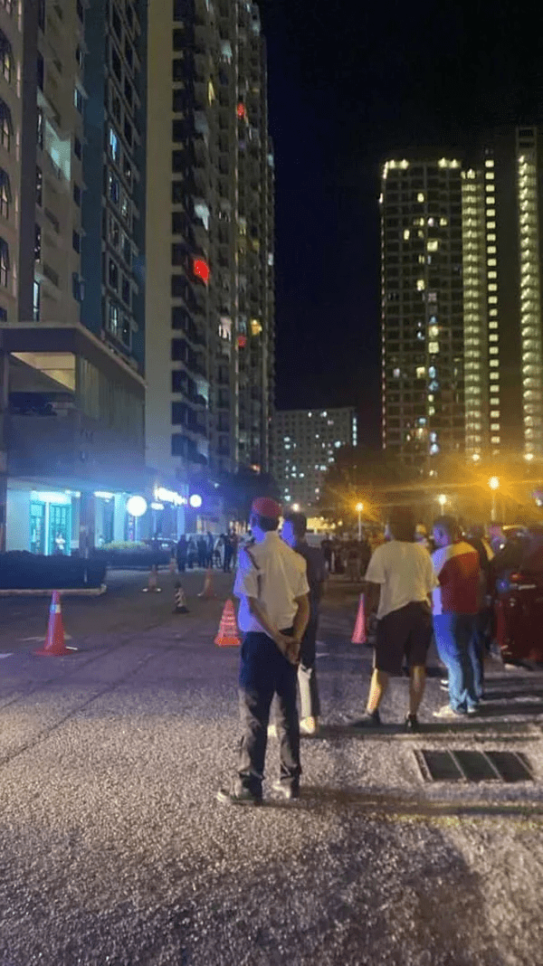 Onlookers gathering around at Sungai Ara apartment 1