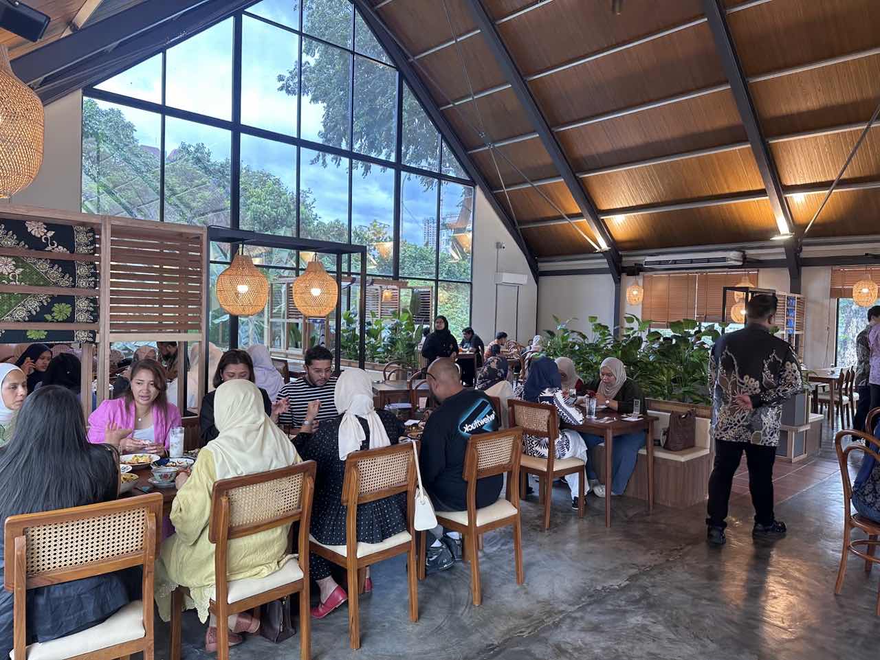 People enjoying the food at Rembayung