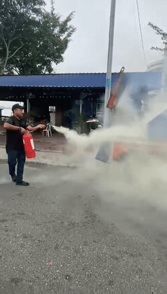 People putting out tow truck fire