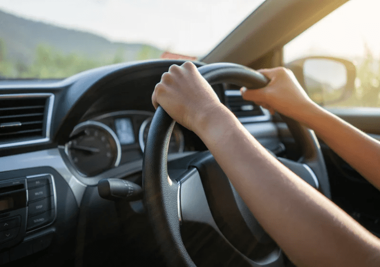 Person driving a car