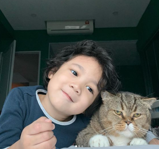 Kid with his furry friend