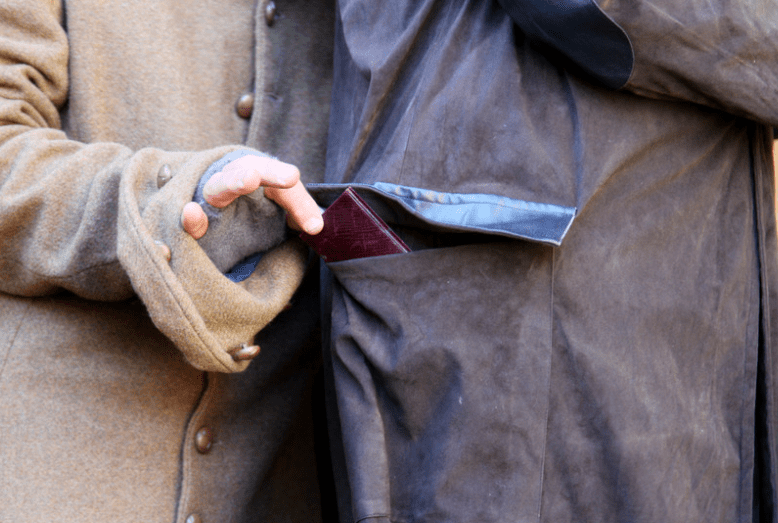 Pickpocket stealing a wallet