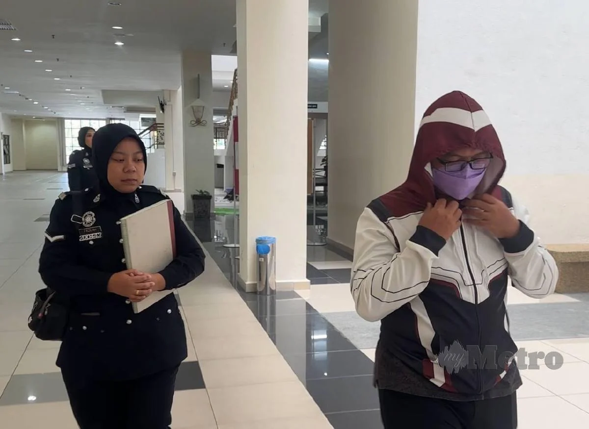 police and accused msian teacher coming out from court
