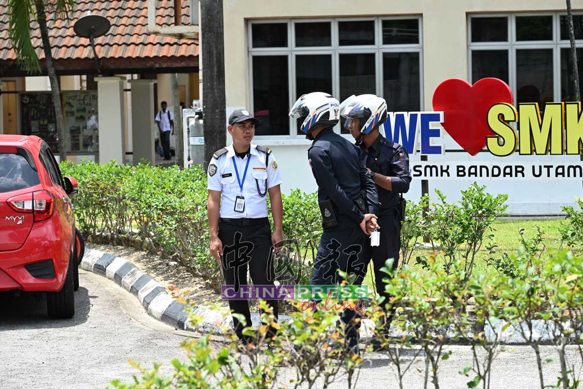 Police outside SMK Bandar Utama after stabbing
