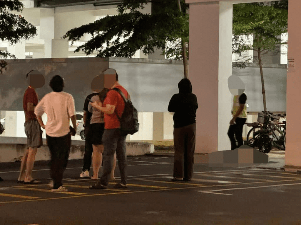 Residents gathering at Kampar apartment where student fell