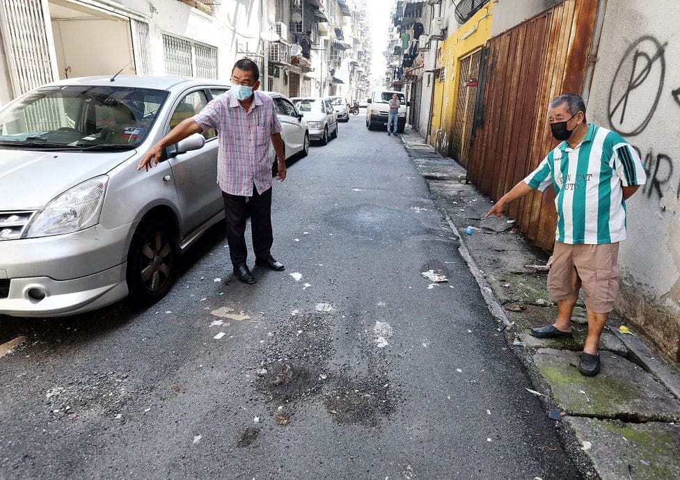Residents of Kepong apartment showing where poop was thrown