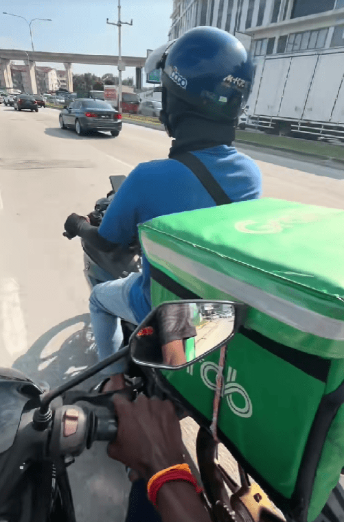 rider pushing another rider's motorbike