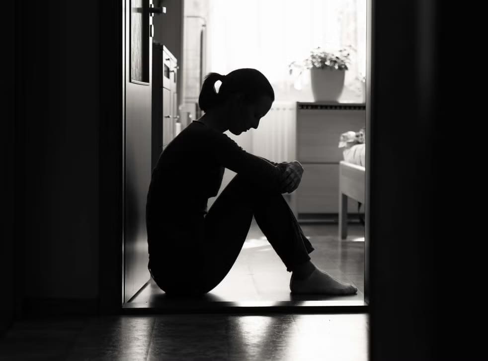Woman sitting in BNW background 