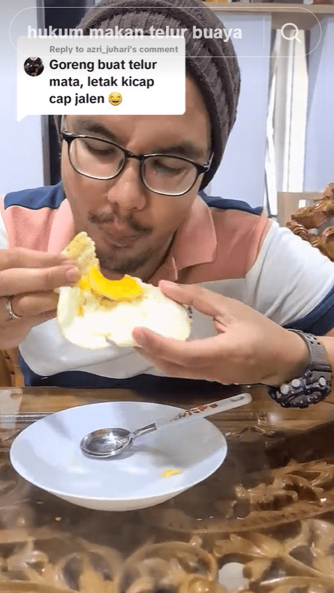 Malaysian man eating crocodile egg
