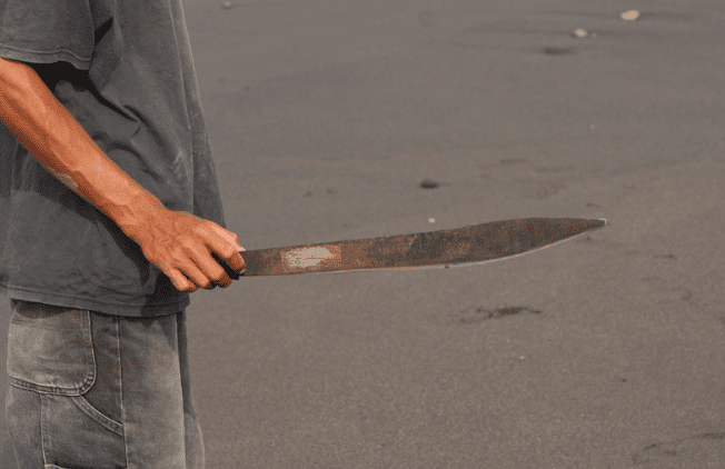 Man holding parang