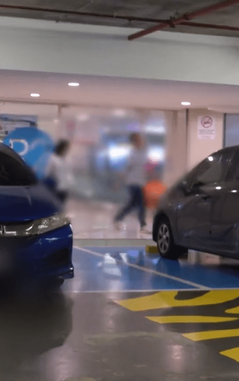M'sian couple return to their car at OKU parking lot at IOI City Mall