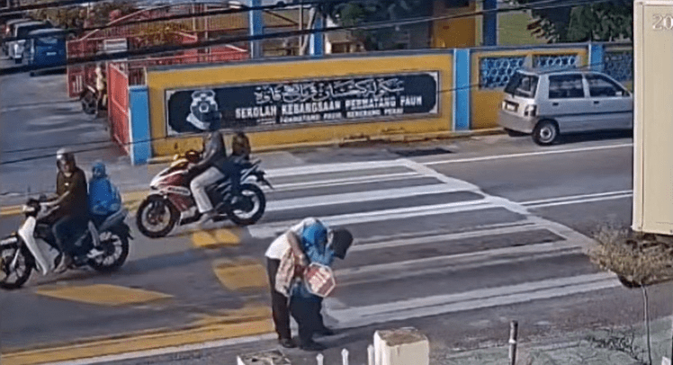 Security guard comforts girl who got hit by motorcycle in Penang