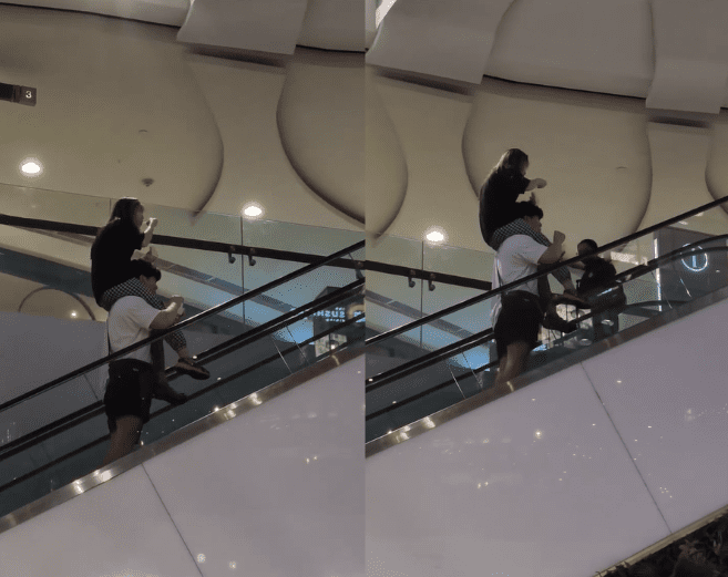 SG couple taking escalator while performing risky act
