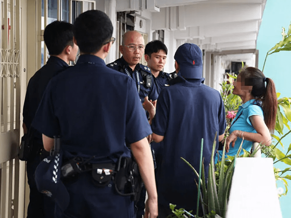 SG parents speaking to police in front of Toa Payoh flat