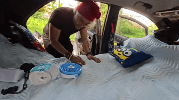 showing the bed in his car