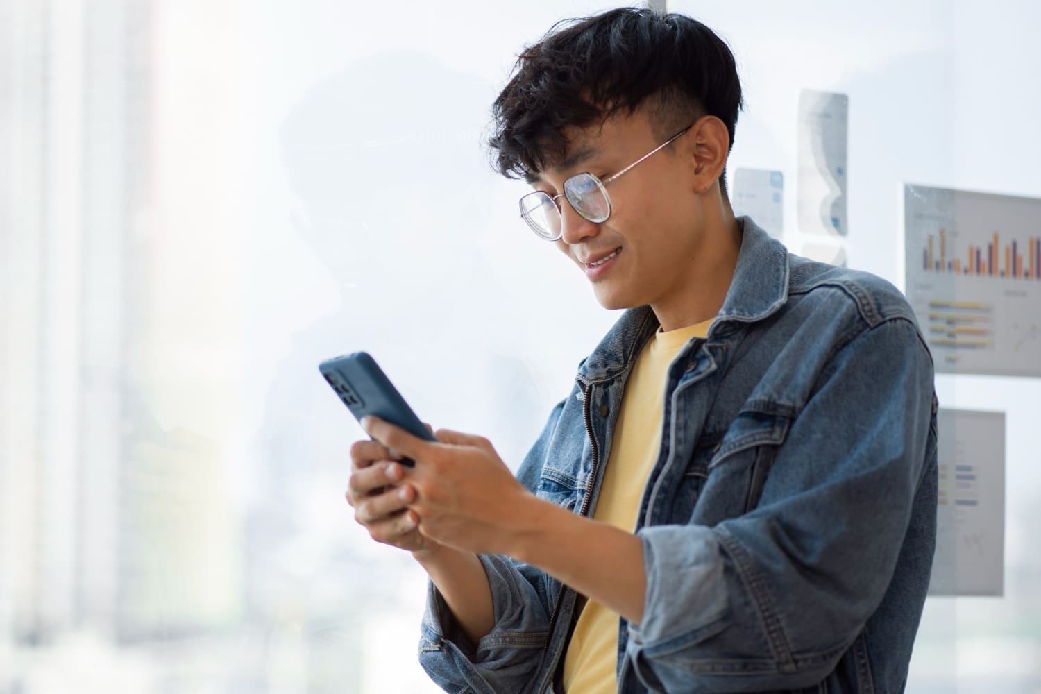 side-view-man-holding-smartphone