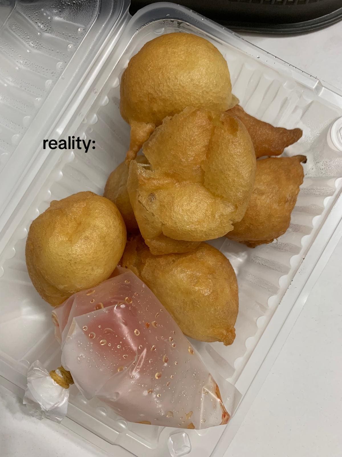 squid fritters with a pack of chili sauce