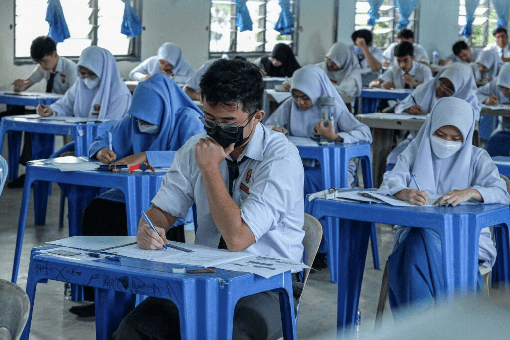 Students taking SPM exam in school
