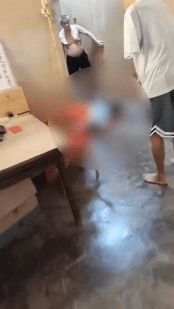 Tan An Man lying on the ground