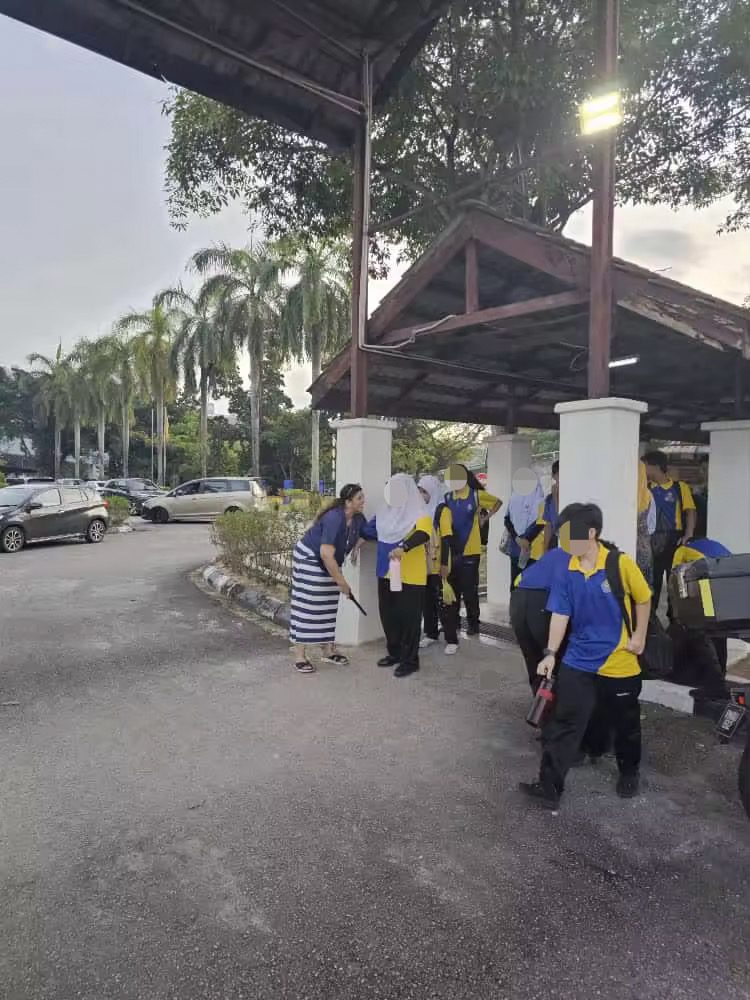 Teachers using metal detectors at BU school 1