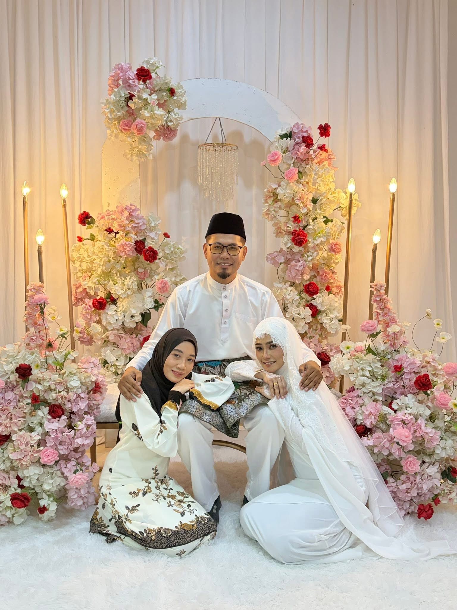 T'gganu man with his 2 wives (2)