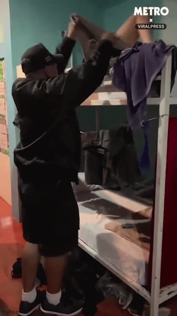 Thai policeman tucks drunk tourists in