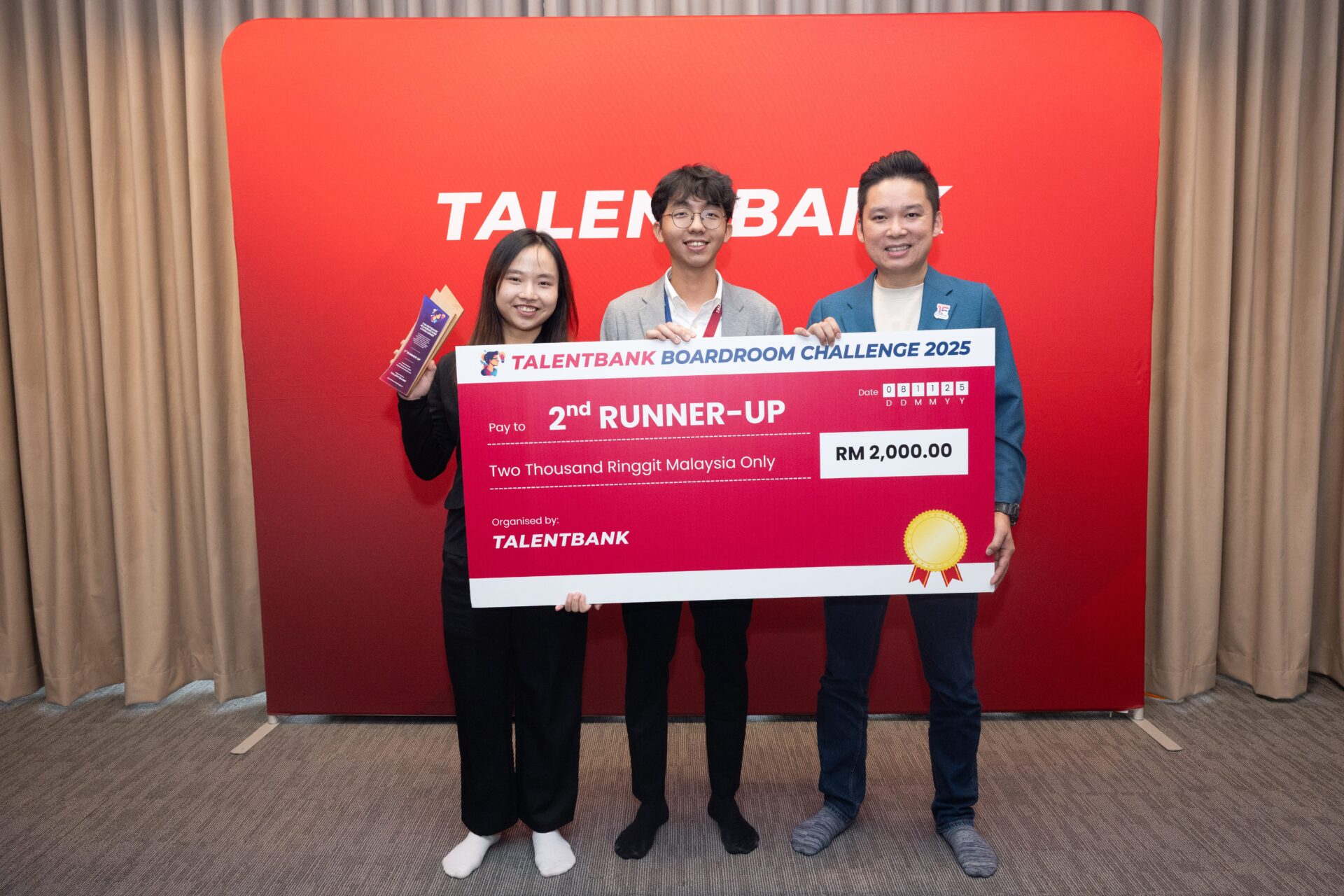 The 2nd Runner-Up duo celebrates their win with the trophy in hand.