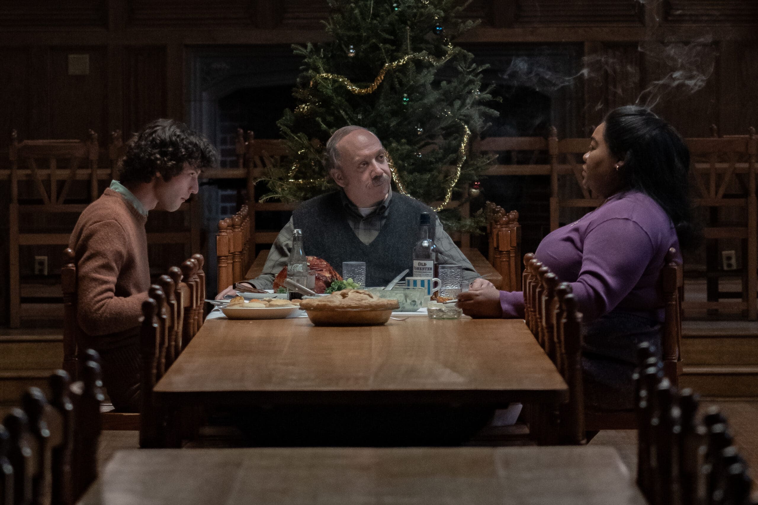 three people having dinner at a dining hall