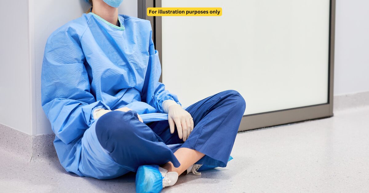 tired doctor sitting on the floor