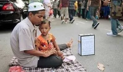 Traffic light beggar with kids