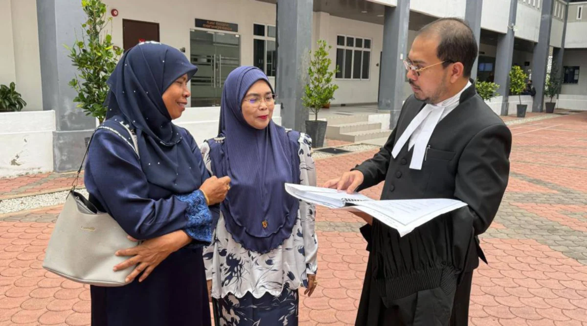 two women with their lawyer