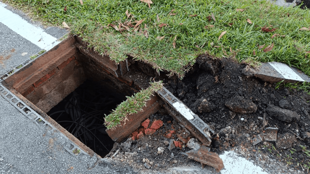 Uncovered cable manhole