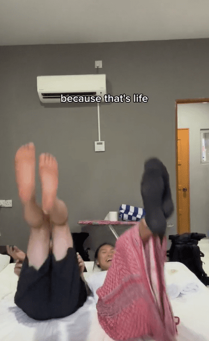 US couple lay on the bed at Langkawi hotel