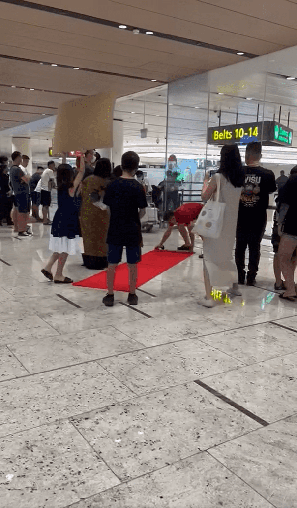 Family waits for grandma at Changi Airport