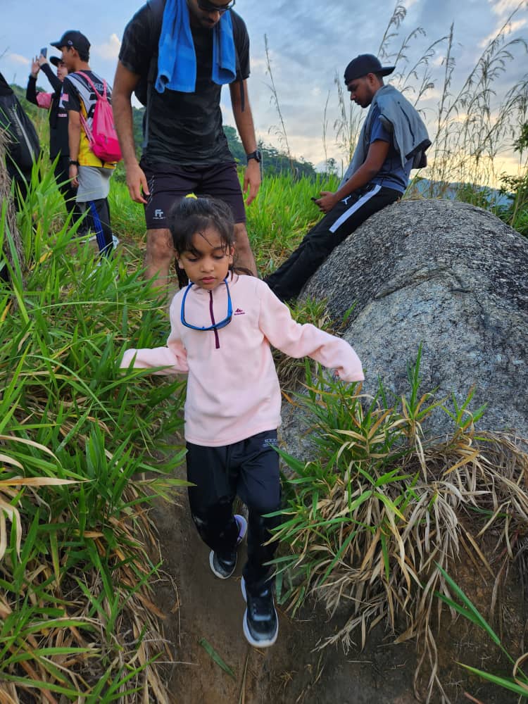 6yo Jacquelin Kaur climbing down a slope
