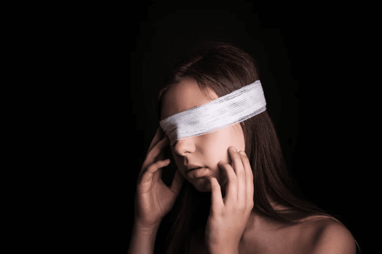 Woman blindfolded with handkerchief