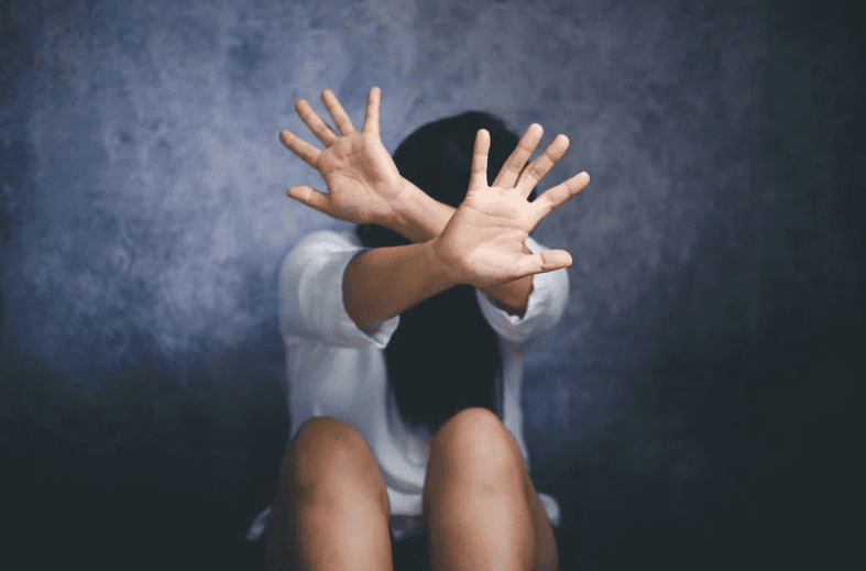 Woman covering her face