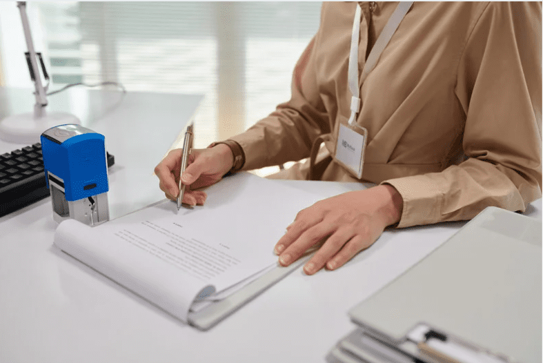 Woman filling up forms