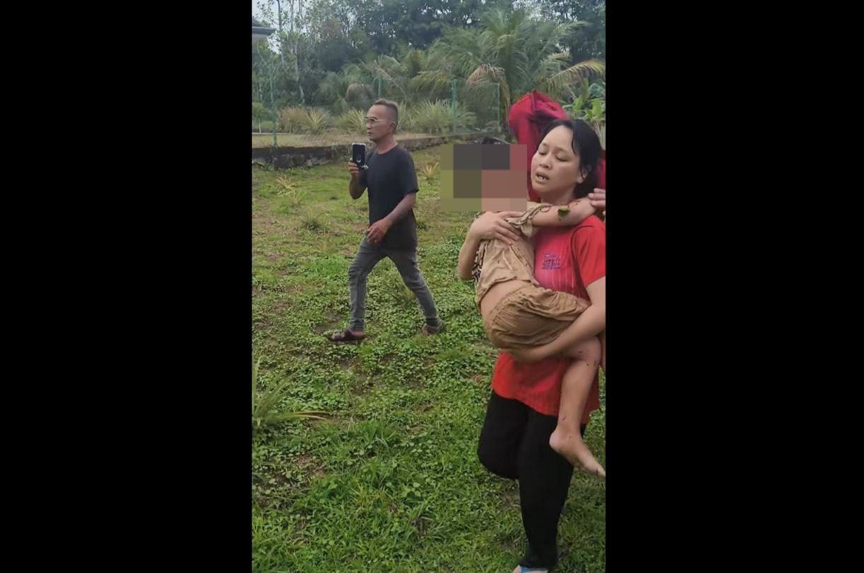 woman holding a kid