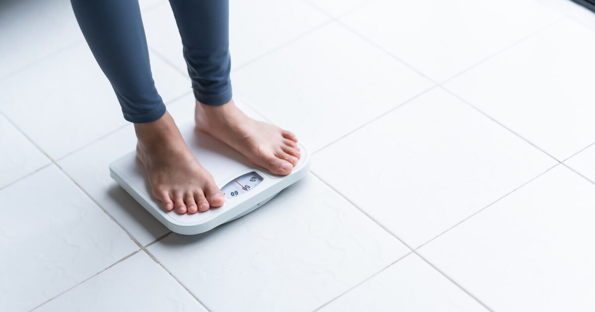 woman on weighing machine