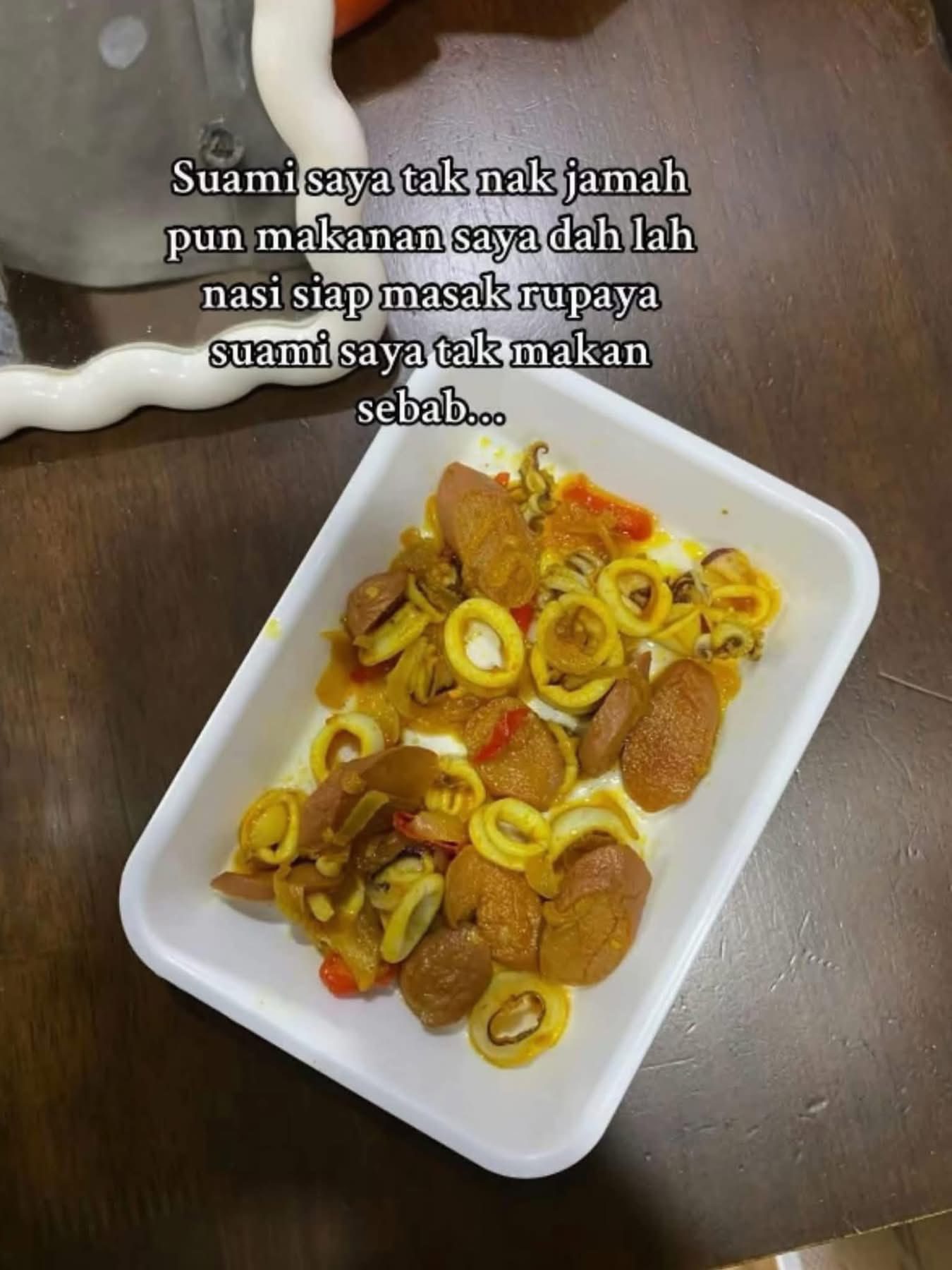 Woman prepares squid dish for deceased husband