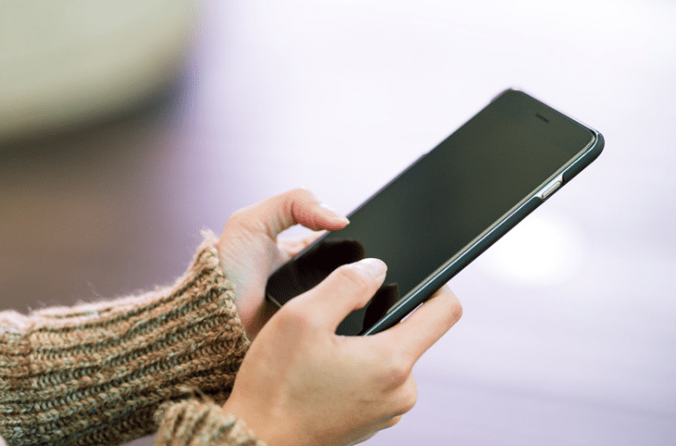 Woman using handphone