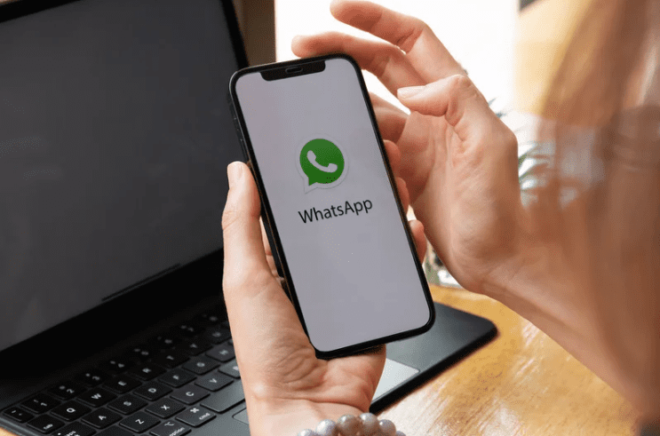 Woman using WhatsApp on her phone