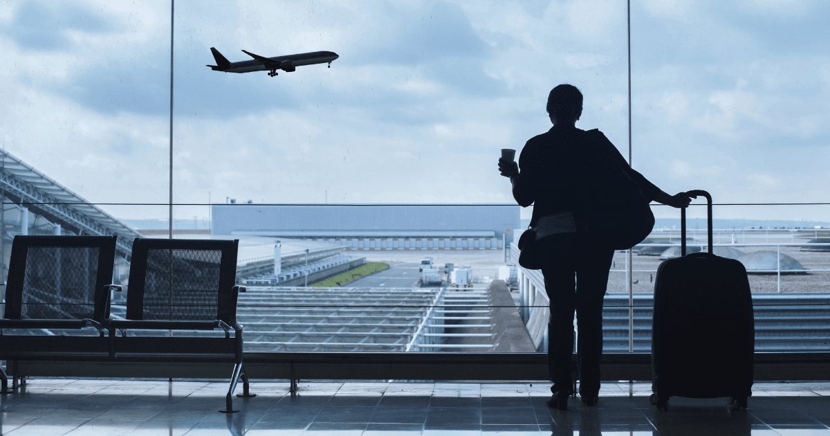 woman waiting for her flight at airport