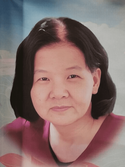 Woman who fell and died inside drain