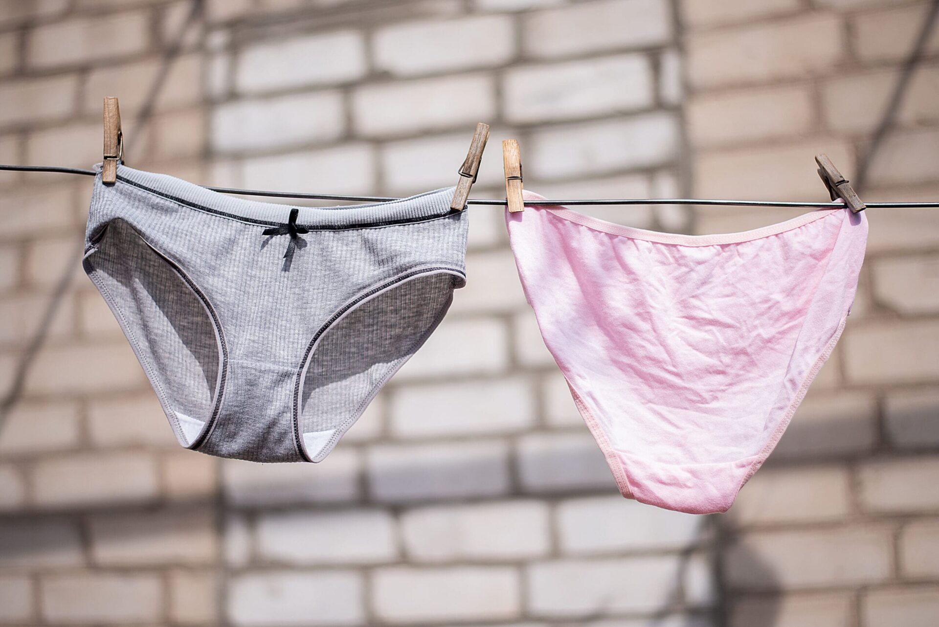 Women's panties underwear after washing dry on a rope